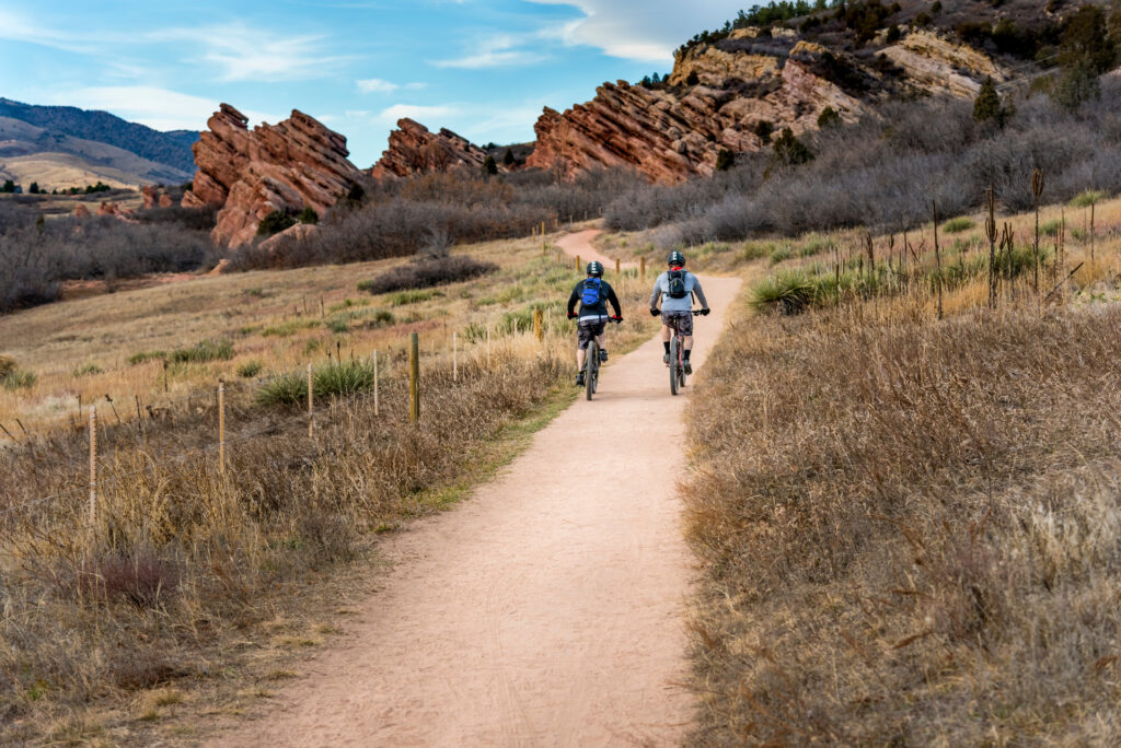 Two mountain bikers exercising on bike trail