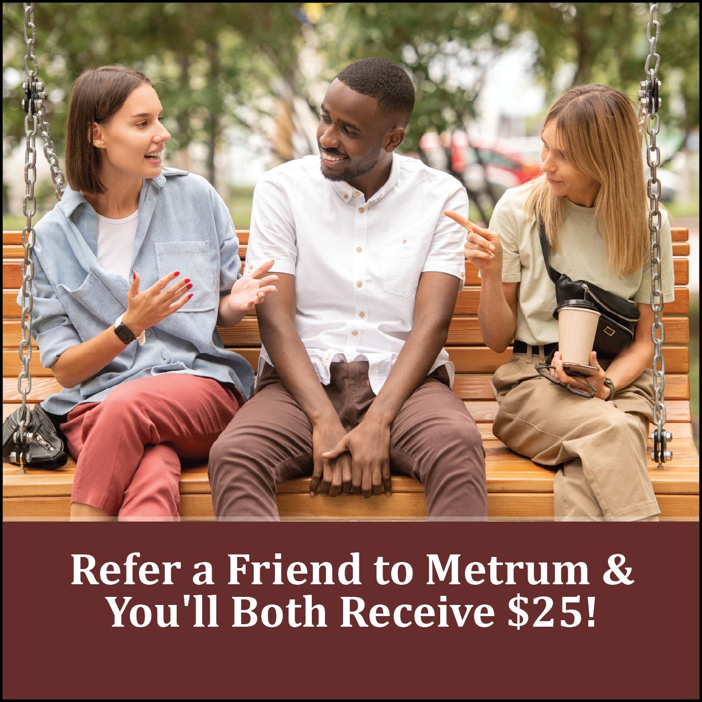 A man sitting between two women on a swing promoting Metrum's refer a friend benefits.