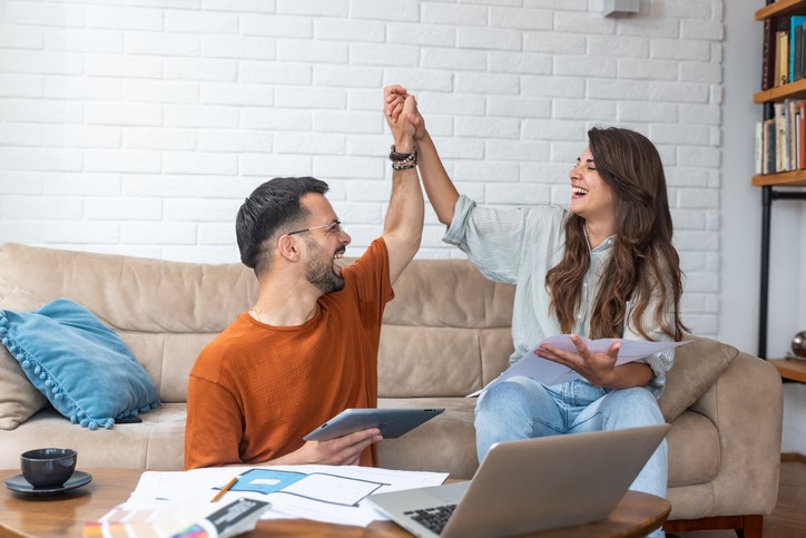 two people high fiving